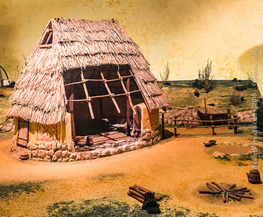 A reconstruction model of the via Vagnotti hut (Iron Age, Late Villanovan). An oval dwelling with dry stone perimeter wall and holes for the placement of posts to support the roof. Museum of Etruscan Academy (MAEC) - Cortona, Italy.