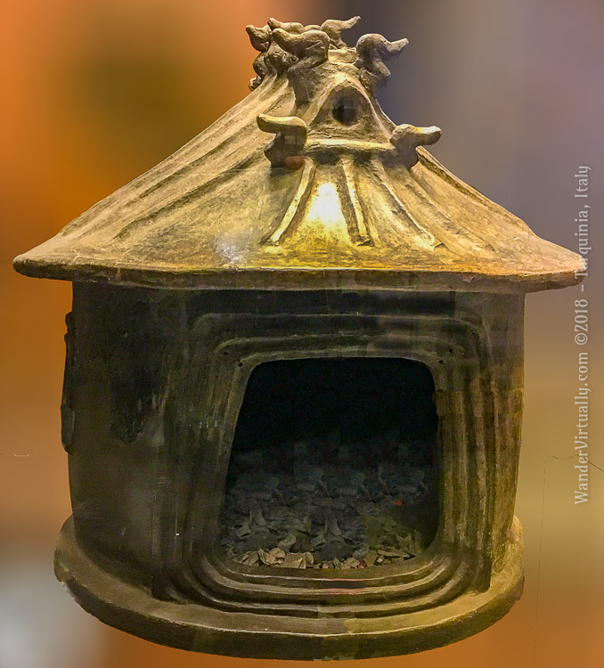 A Villanovan cinerary hut urn made of impasto, 9th century BCE. This hut urn is likely a replica of an actual Villanovan home. National Etruscan Museum - Tarquinia, Italy.