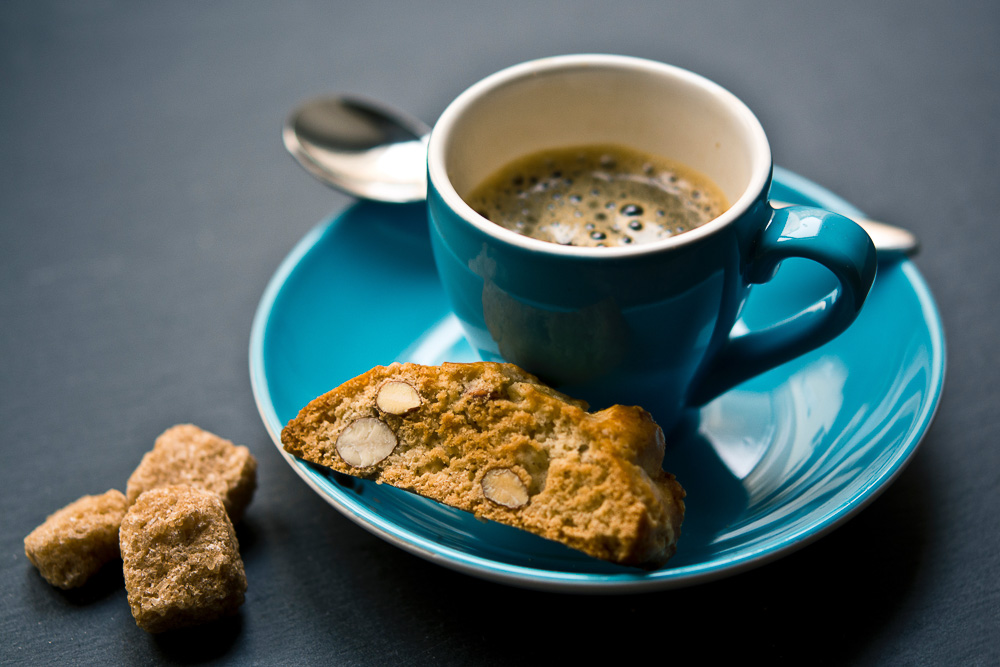 Typical breakfast in Italy: Espresso and biscotto. Photo by Jonathan Pielmayer on Unsplash.