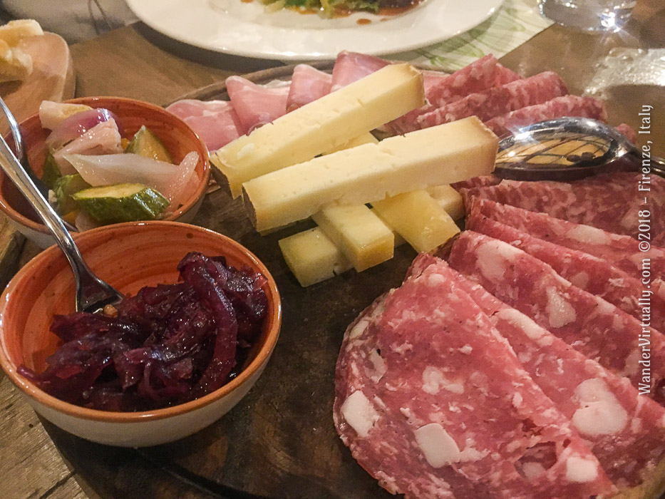 Cold cuts board with prosciutto, salame, pecorino cheese @ Ristorante Tosca of Mercato Centrale, in Firenze, Italy.