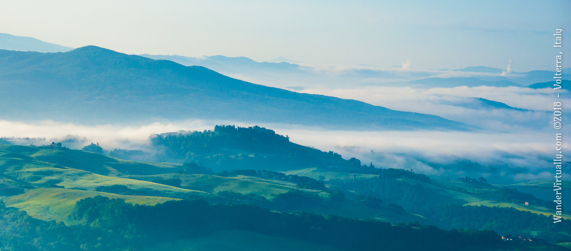 Mystical view of the Tuscan countryside at dawn - Volterra, Italy.