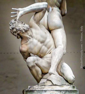 An old man cowers, in Giambologna's Rape of the Sabine Women.